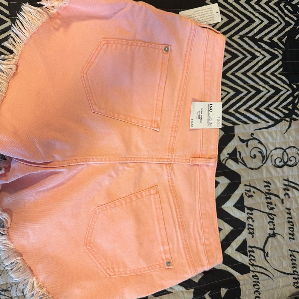 Denim coral colored shorts. Brand new with tags. Cute fringe in the bottoms. - Picture 3 of 3